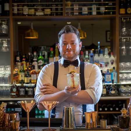 Clayton Hotel Dublin Airport Coolock Bagian luar foto Bartender with a drink