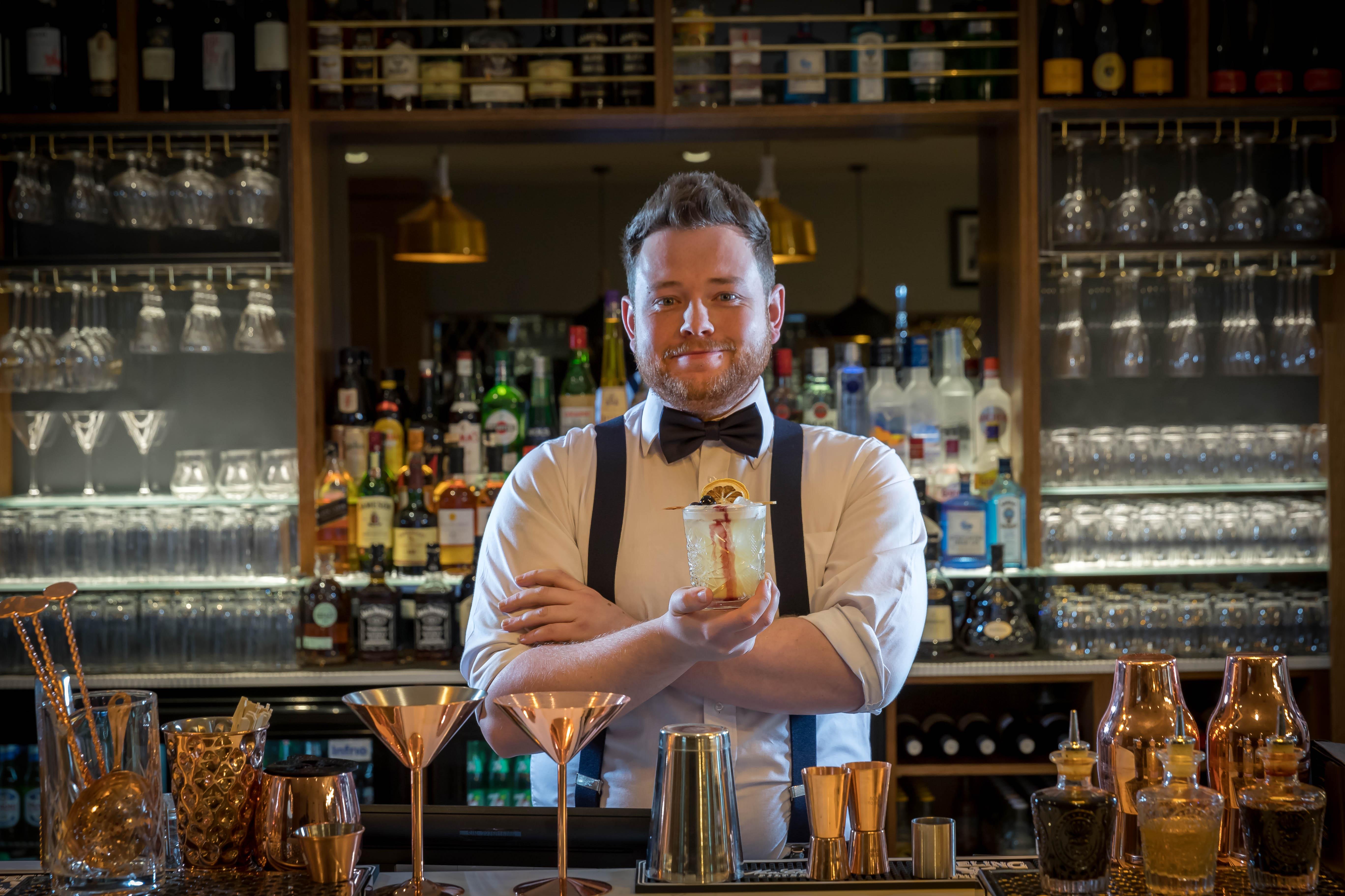 Clayton Hotel Dublin Airport Coolock Bagian luar foto Bartender with a drink