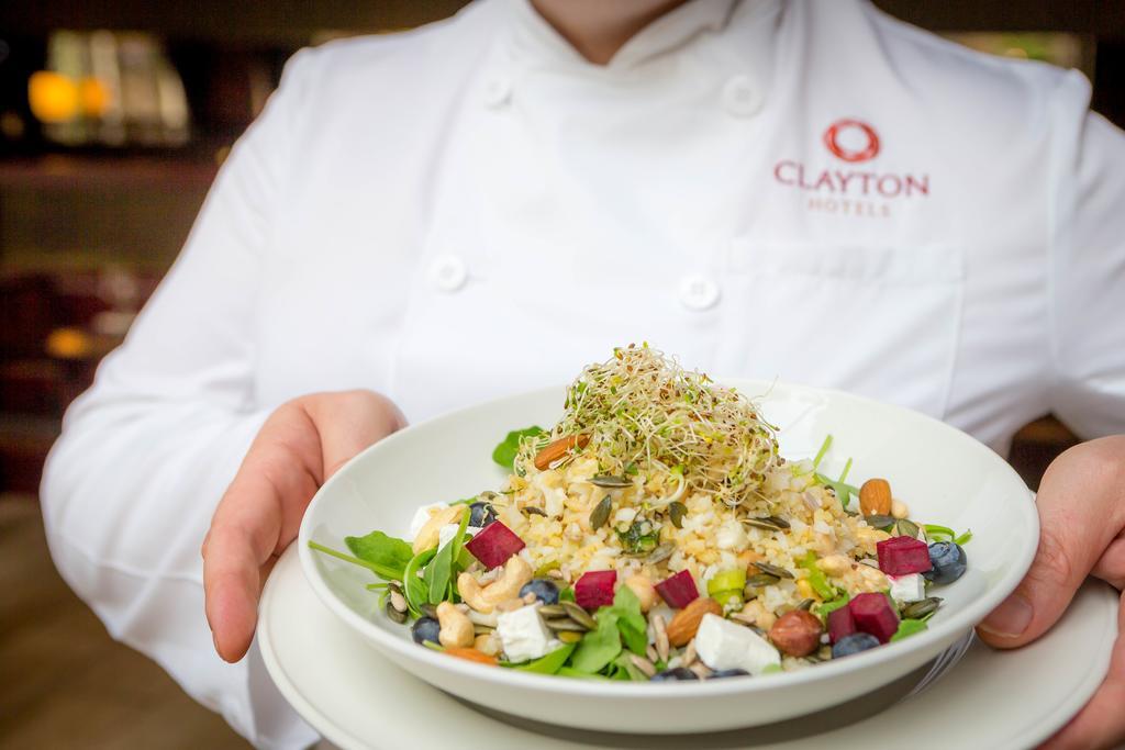 Clayton Hotel Dublin Airport Coolock Bagian luar foto Chef holding a plate of food
