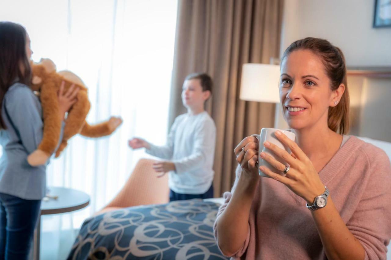 Clayton Hotel Dublin Airport Coolock Bagian luar foto A woman with her children
